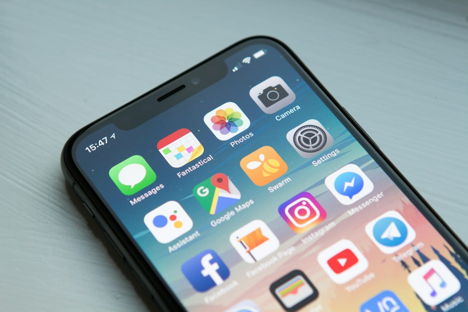 Smartphone home screen with search and travel apps